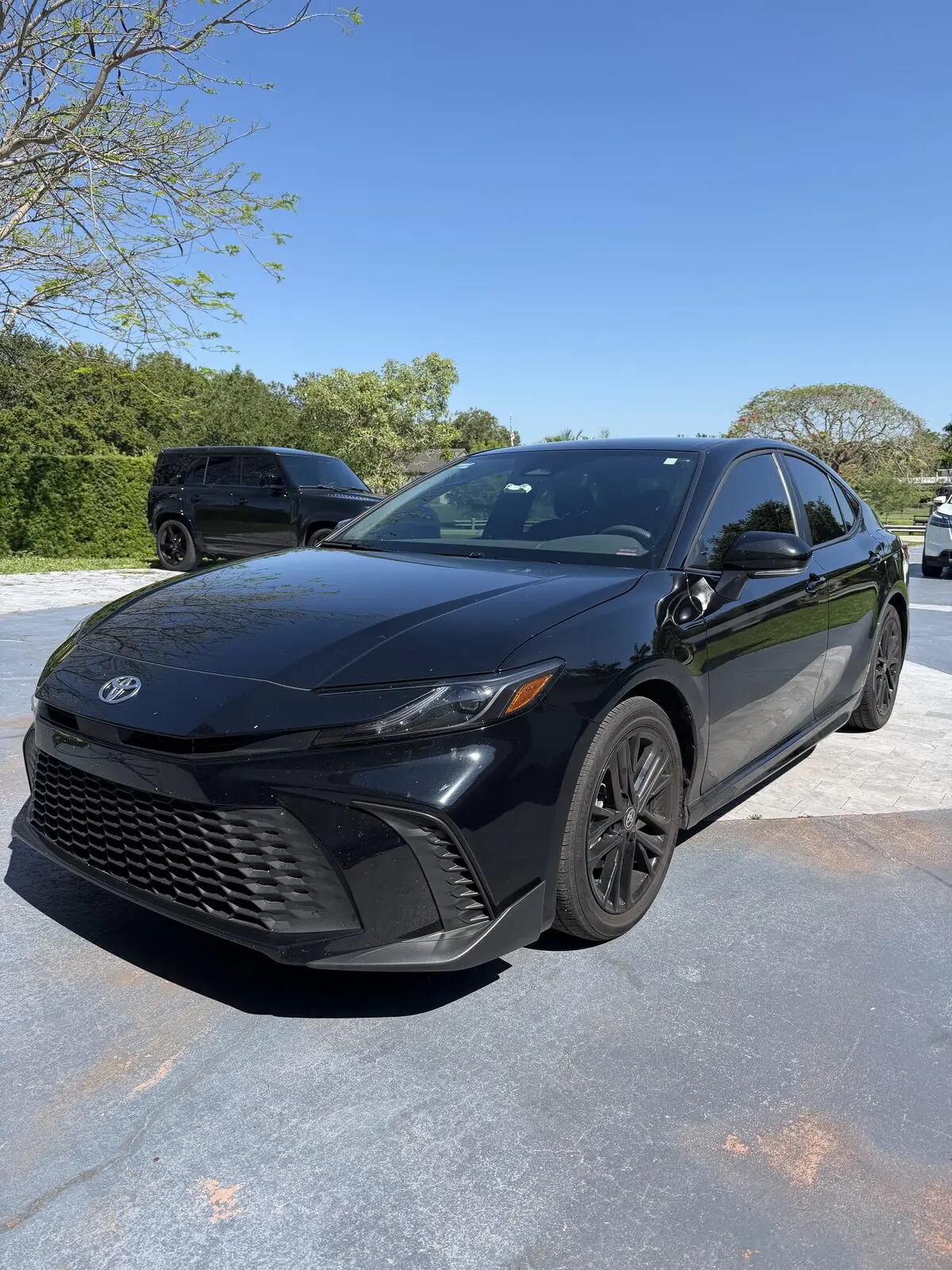 Black Toyota Camry full exterior detail — before